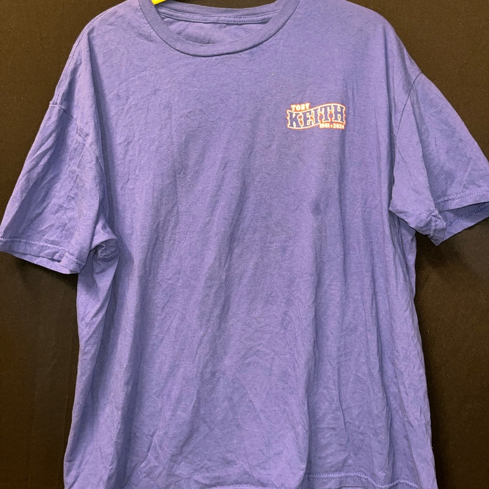 Blue and Red Toby Keith shirt.